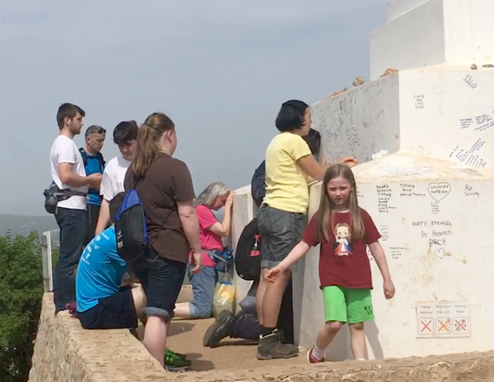 Richard L George family praying before the Cross on Cross Mountain in Medjugorje photograph